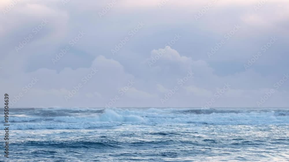 Scenic view of dramatic waves near Icelandic shore. Overcast cold day at a beach. Scenic view of dramatic waves near Icelandic shore. Overcast cold day at a beach.
