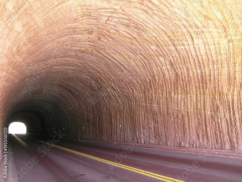 Road tunnel in the red rock in national park USA
