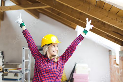 blond, beautiful woman is overjoyed with the idea to expand the loft