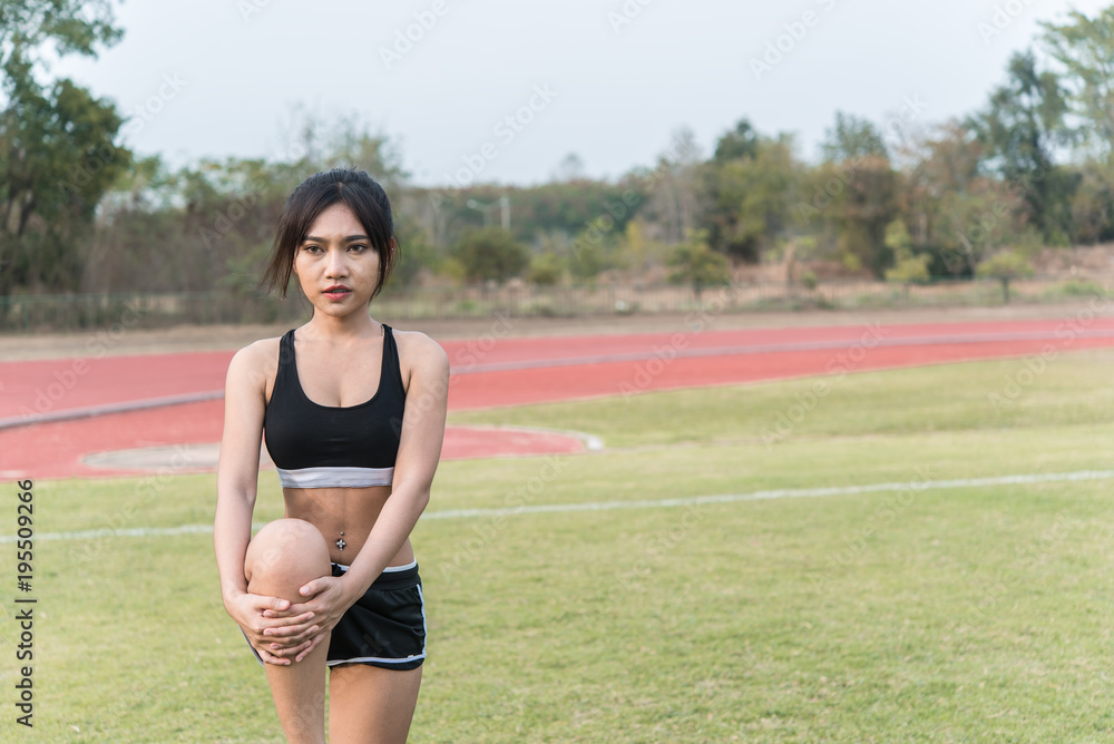Beautiful asian woman stretching body in the field,Thailand people Beautiful asian woman stretching body in the field,Thailand people