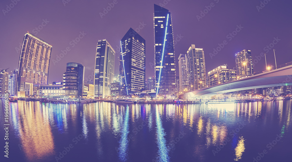 Fisheye lens picture of Dubai Marina at night, color toned picture, United Arab Emirates.