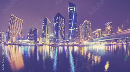 Fisheye lens picture of Dubai Marina at night  color toned picture  United Arab Emirates.