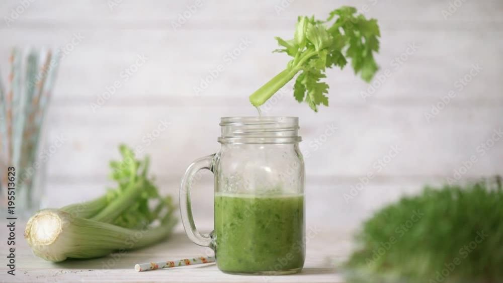 Cinemagraph - Pouring the celery juice into a glass. Nobody. Motion Photo. Cinemagraph - Pouring the celery juice into a glass. Nobody. Motion Photo.