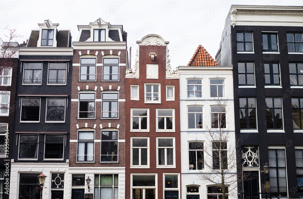 Traditional color contrasted dutch buildings in Amsterdam Traditional color contrasted dutch buildings in Amsterdam