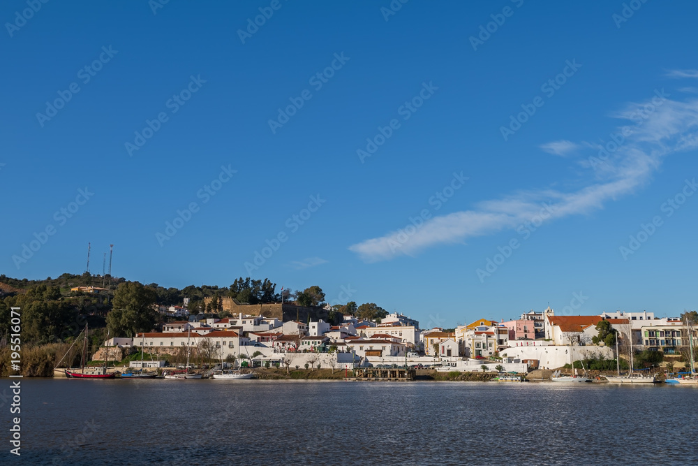 View of the Portuguese settlement of Alcoutim from the opposite bank of the Guadiana river - Spanish village Sanlucar de Guadiana