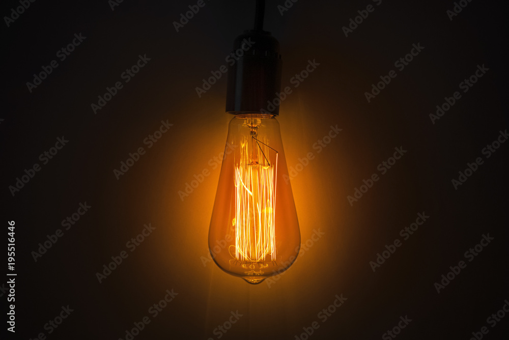 Old vintage edison bulb in the dark