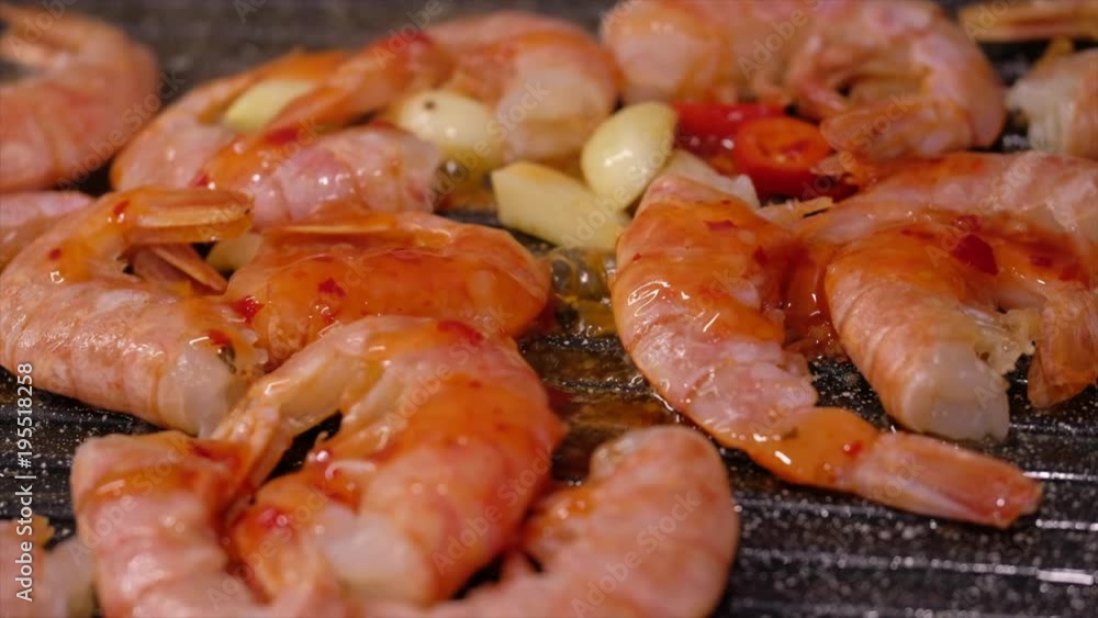 Fresh prawns with chilli and garlic on the grill Fresh prawns with chilli and garlic on the grill