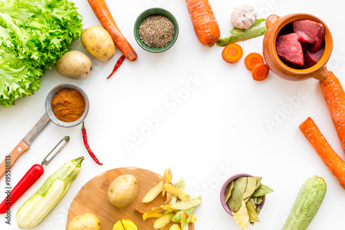 Diet vegetarian vegan food. Ratatouille or vegetable ragout. White table background top view mockup