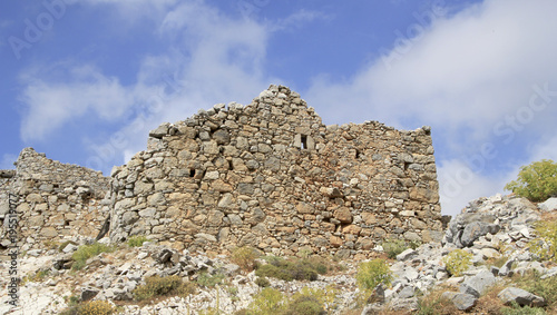 Ruins of ancient Venetian windmills built in 15th century, Lassithi Plateau, Crete, Greece. Most typical characteristic of the Plateau. In the past, they numbered thousands making up a magnificent la