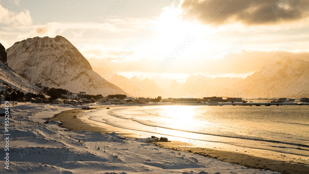 Sunset in a snow covered beach in Lofoten Island, Norway