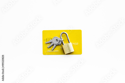 Electronic payments protection. Bank cards near lock and keys on white background top view copy space