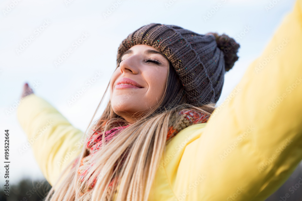 Beautiful young woman enjoying nature in the park. Beautiful young woman enjoying nature in the park.