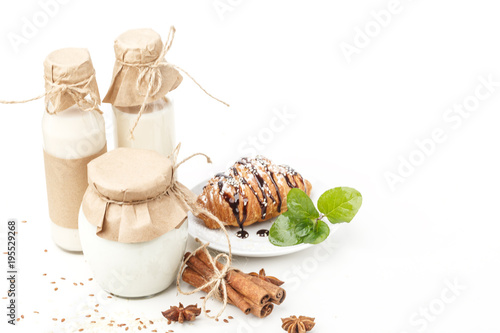 Dairy products with anise and cinnamon on a white background. Healthy eating. Isolated. photo