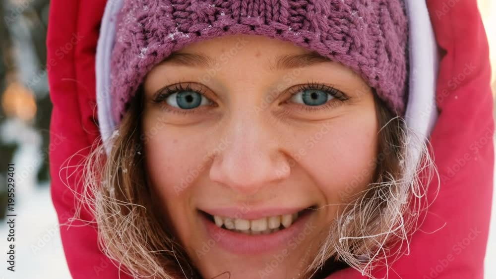 Portrait of beautiful girl with blue eyes smiling camera close-up, hair in frost from cold, 4k Portrait of beautiful girl with blue eyes smiling camera close-up, hair in frost from cold, 4k
