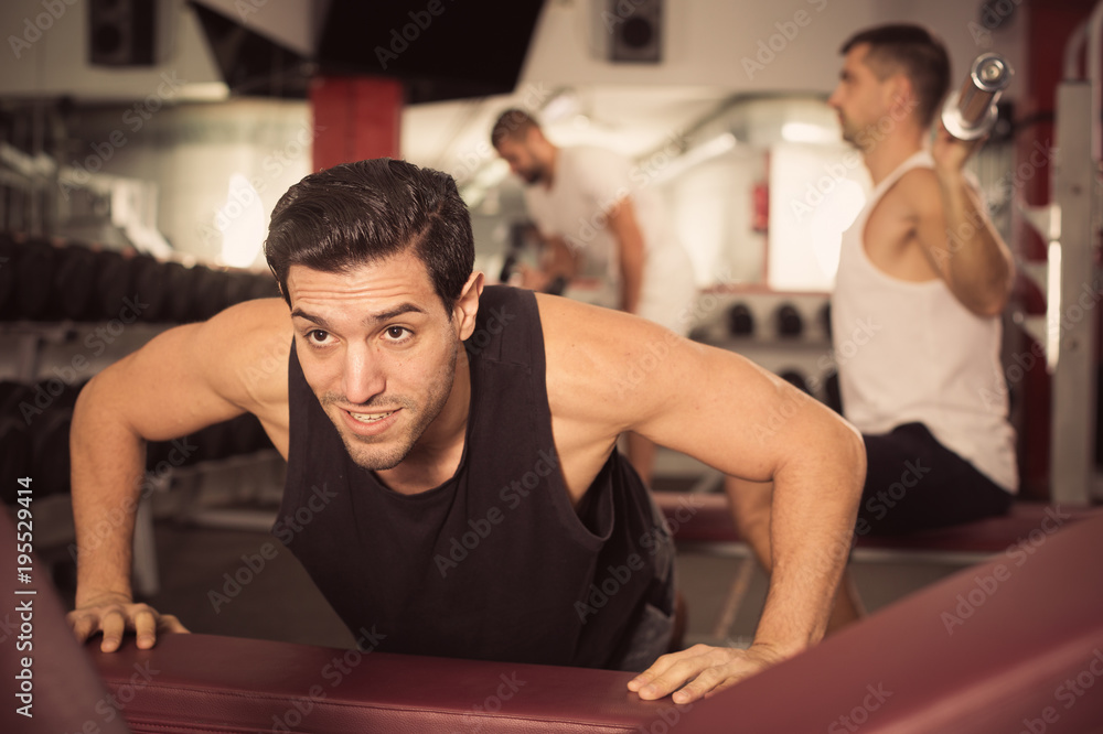 Fototapeta premium Man performing push-ups during training