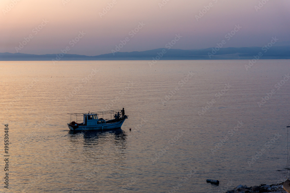 Sunset view on embankment of Thassos town, East Macedonia and Thrace, Greece 