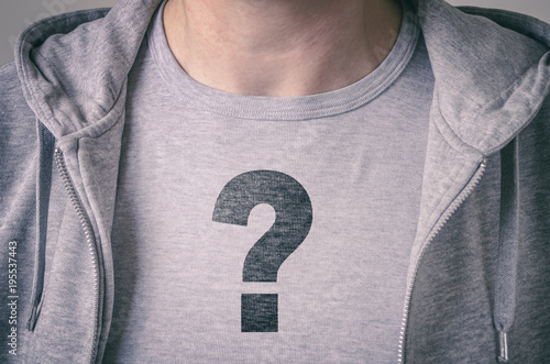 Boy with question mark on T-shirt. Conceptual image of confusion and identity issues. photo
