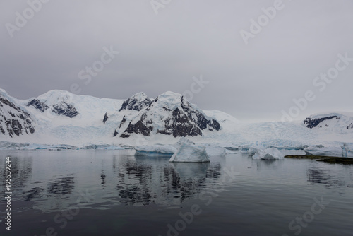 Antarctic landscape with icebergs and reflection © Alexey Seafarer