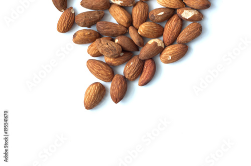 A lot of almond grains on a white background.