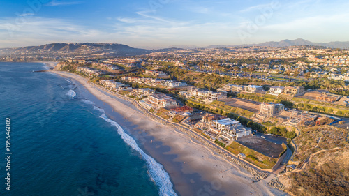 Aerial view of Southern California beach in Dana Point, Orange County on a sunny afternoon.