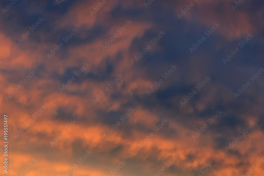 Blurred background texture from colorful dramatic sunset in the sky.