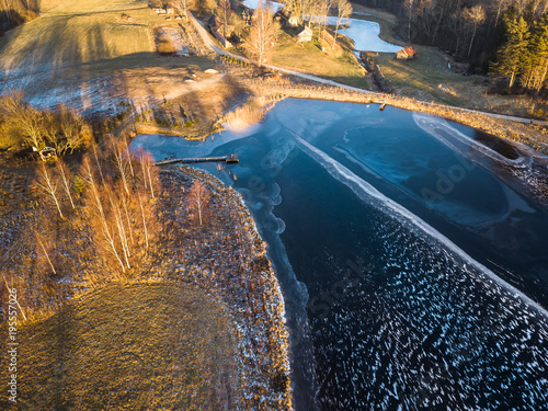 Fototapeta Naklejka Na Ścianę i Meble -  Drone Photography of Countryside Landscape in Winter - Sun Flare