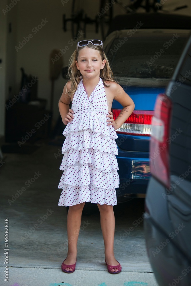 Naklejka premium Sill Girl in Garage with Sunglasses Making Faces