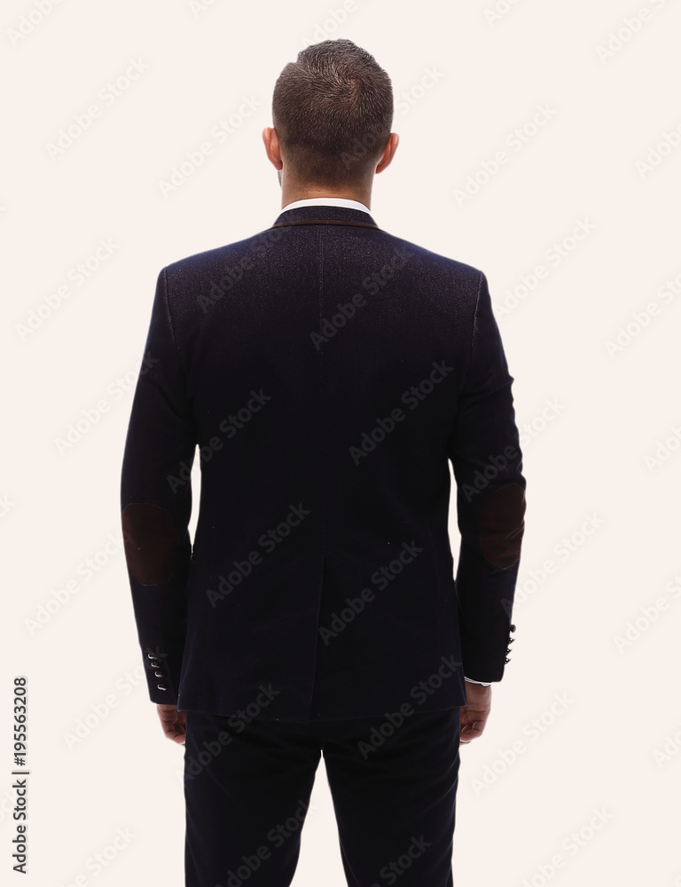in full growth.rear view of a successful businessman. in full growth.rear view of a successful businessman.