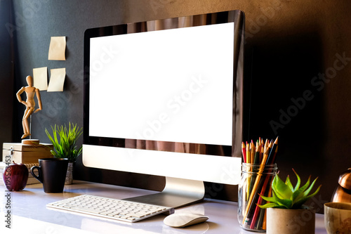 Mockup of creative desktop of designer at dark interior workplace.