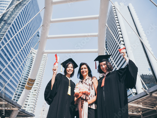 Beautiful woman congratulates for her family on graduation day, Successful concept