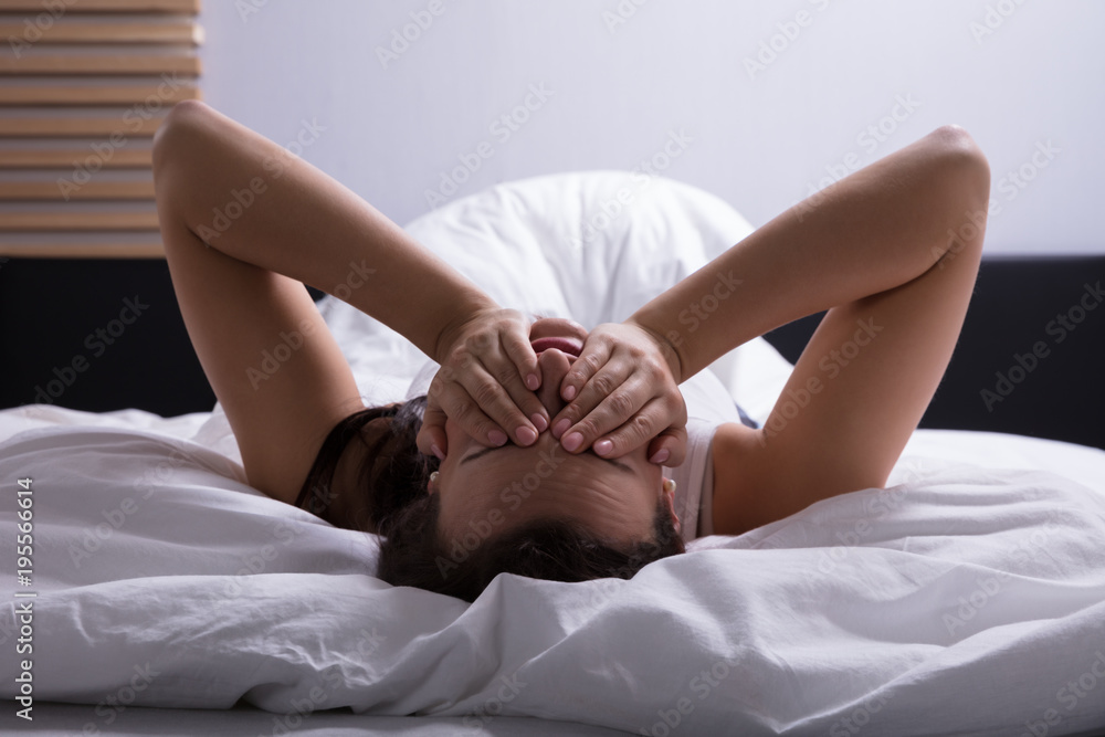Stressed Woman Lying On Bed Stressed Woman Lying On Bed