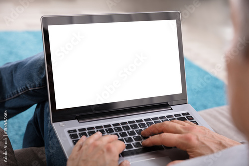 Close-up Of A Person's Hand Using Laptop