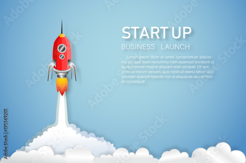 Rocket launch on the clouds and blue sky as paper art, craft style and business Startup project concept. flat design vector illustration. © ImagineDesign