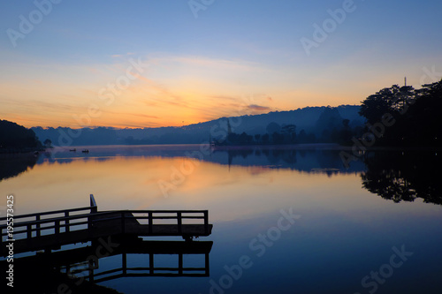 small bridge reflect on lake at sunrise