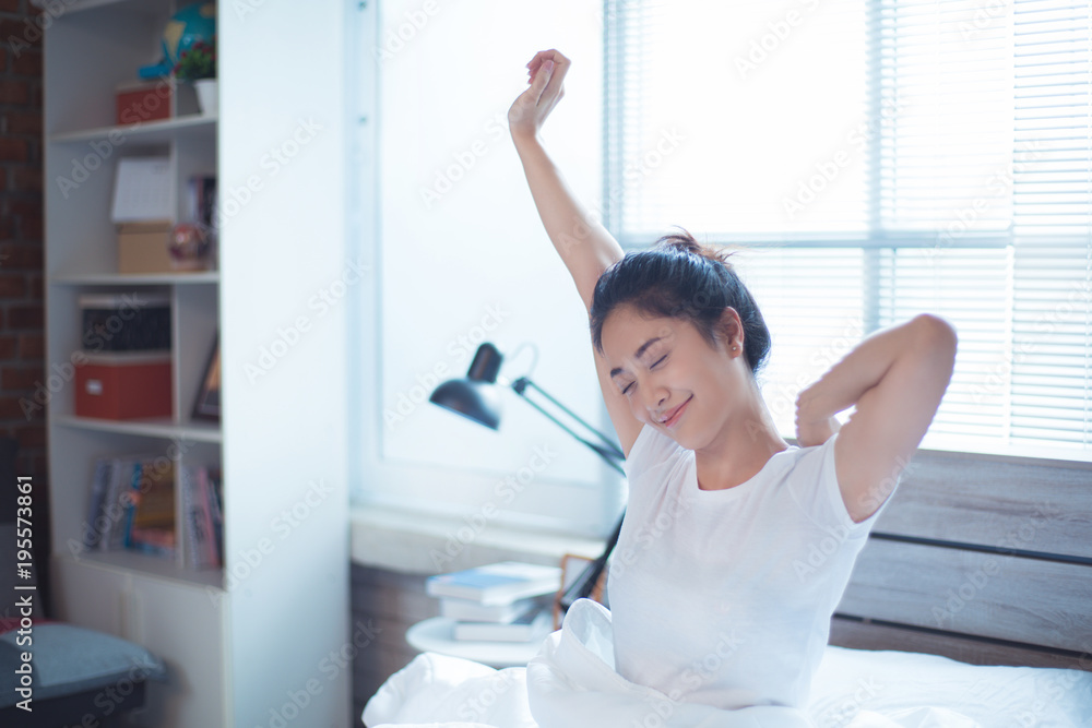Asian women She is in bed and was waking up in the morning. She felt very refreshed. Asian women She is in bed and was waking up in the morning. She felt very refreshed.