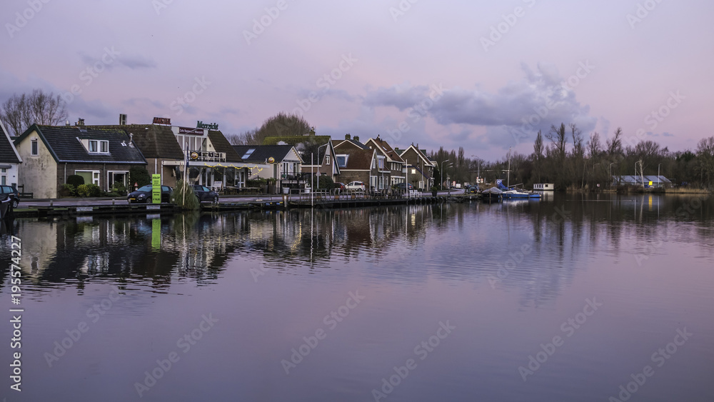 Small Village on the banks of a canal in Amsterdam on a cold wintery morning
