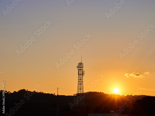 Sunrise with telecommunication tower
