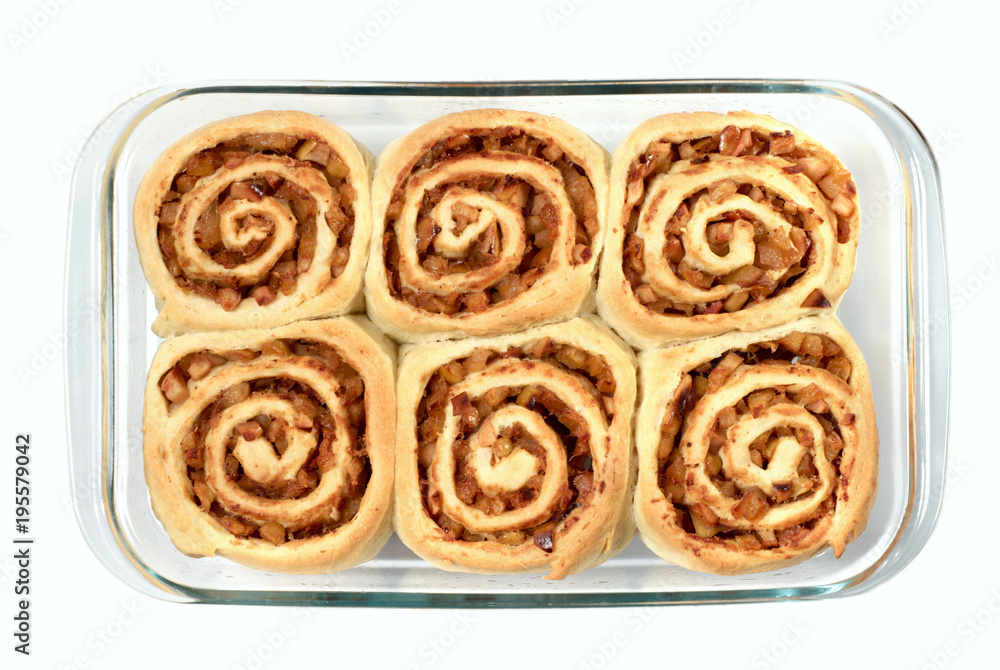 Six tasty rolls with apples and cinnamon, isolated on a white.