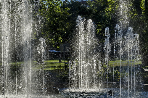 Group from small water fountains flowing in front beauty rockery, Sofia, Bulgaria 