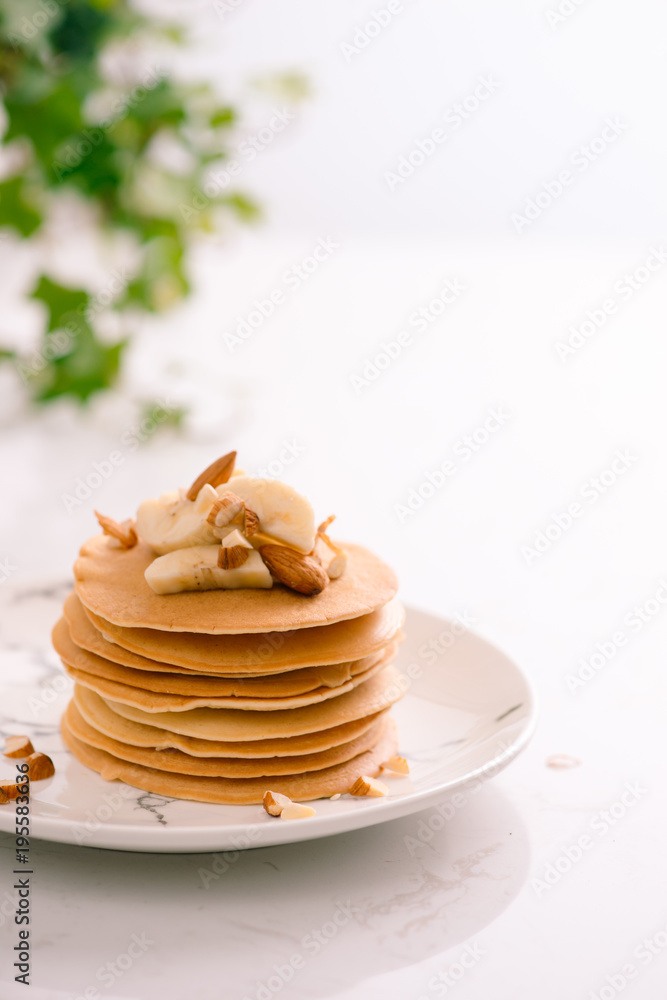 Banana cashew pancakes with bananas and caramel sauce. Banana cashew pancakes with bananas and caramel sauce.