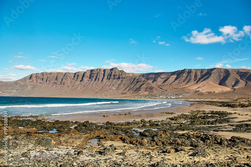 Landscape with volcanic hills and atlantic ocean in Lanzarote