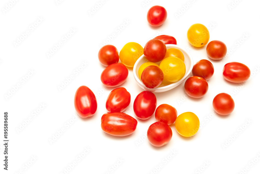Small tomatoes red and yellow isolated on white background Small tomatoes red and yellow isolated on white background