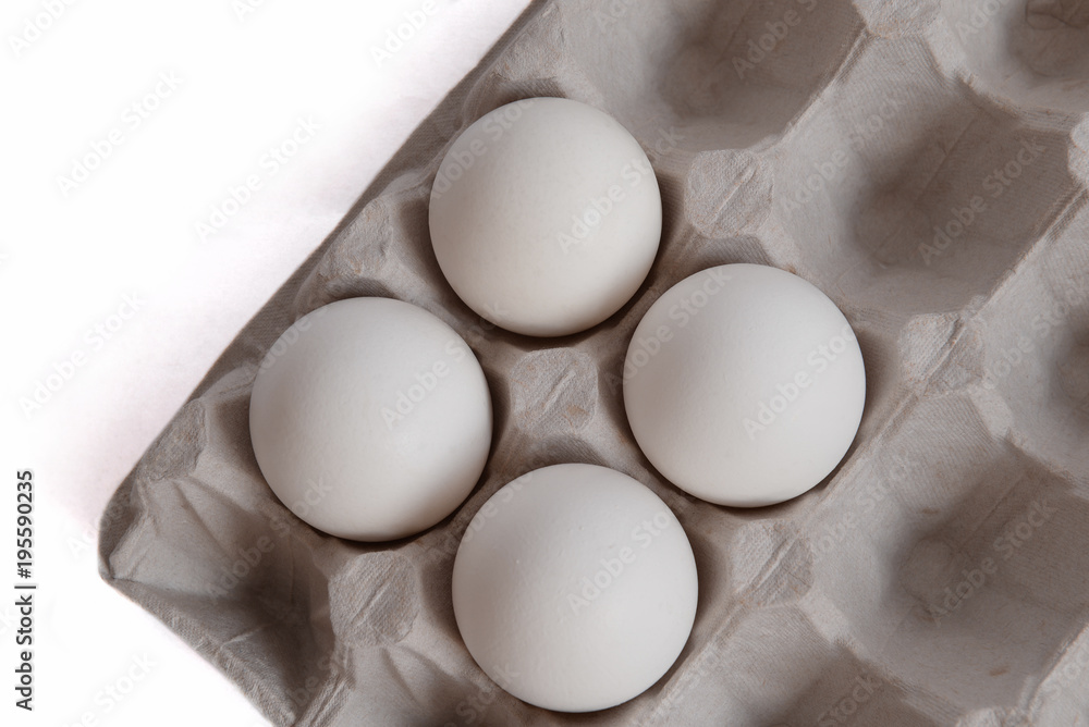 Four chicken eggs in a box Four chicken eggs in a box