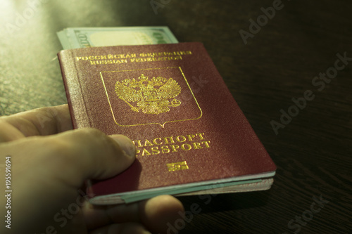 passport with money in hand