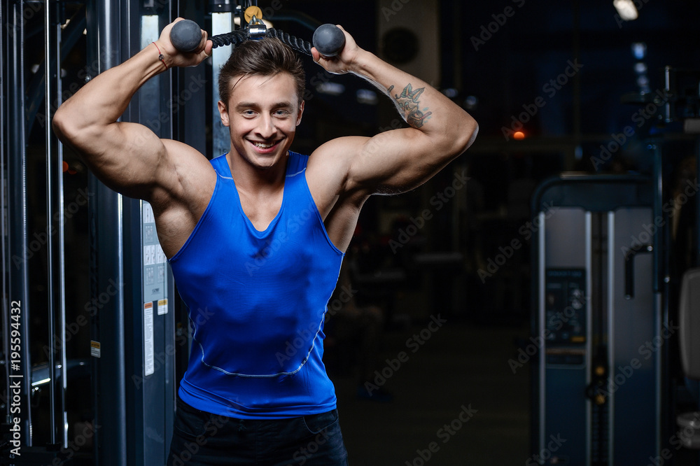 Handsome model young man workout in gym Handsome model young man workout in gym