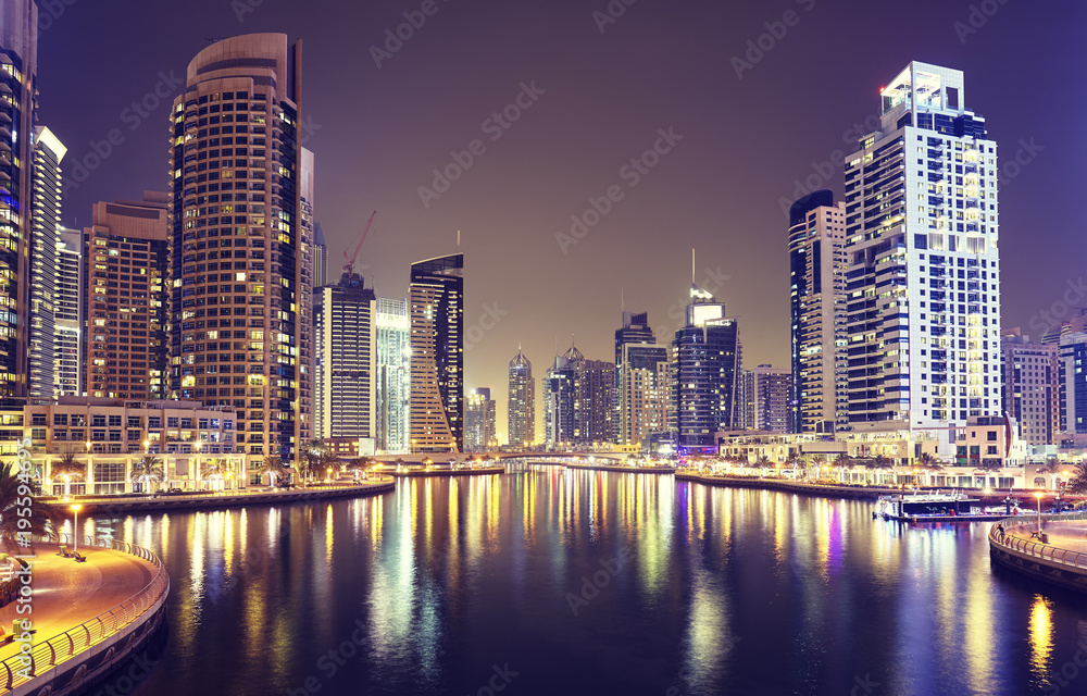 Dubai Marina at night, color toned picture, United Arab Emirates.