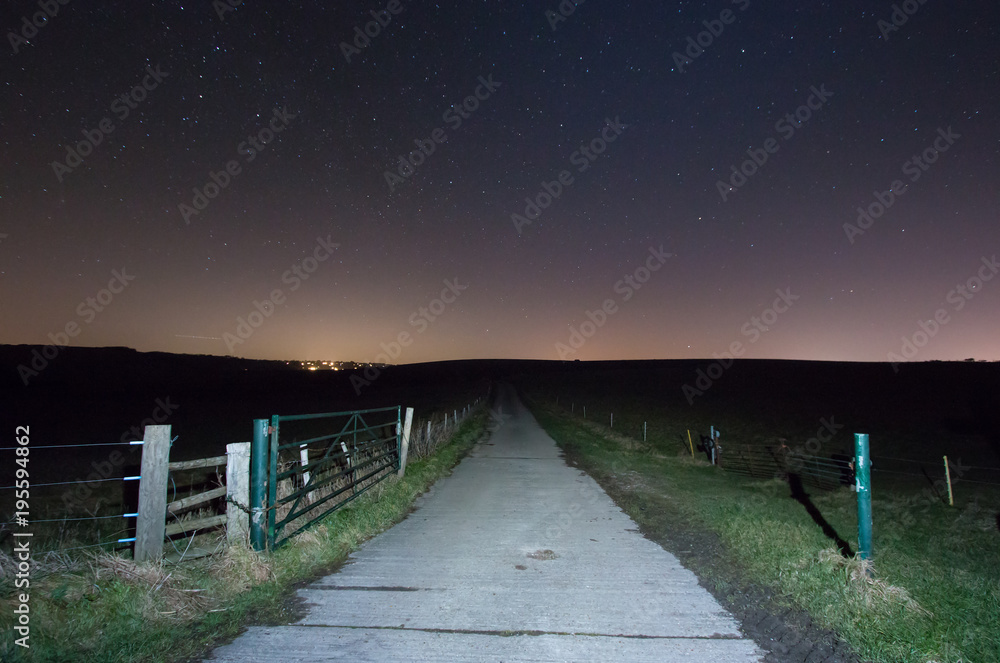 Farm Track under Starry Sky with East Dean Village