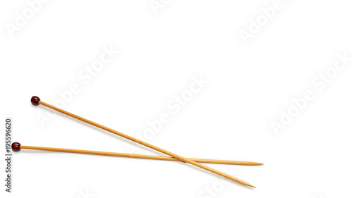 wooden knitting needles, lie crossed. Isolated on white background. copy space, template.