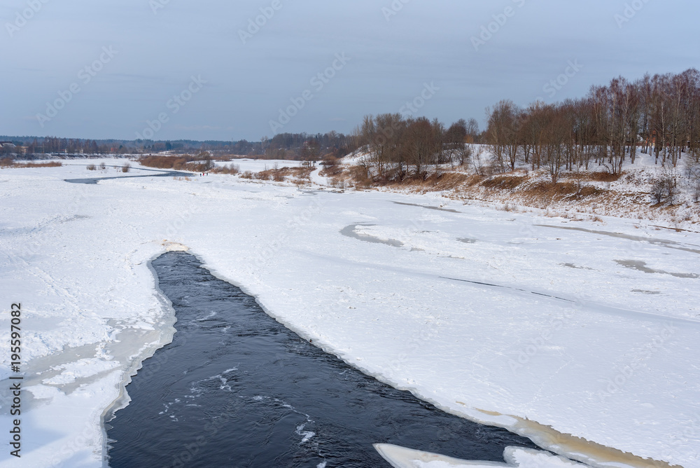 Frozen Venta river in winter at Kuldiga, Latvia.