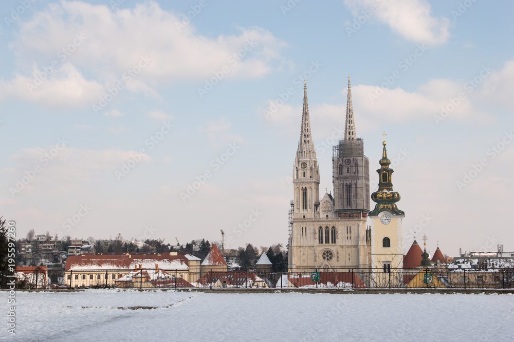 Obraz premium Zagreb Cathedral and city skyline during winter and snow as seen from Gradec, Zagreb, Croatia.